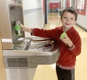boy fills up water bottle at parkview